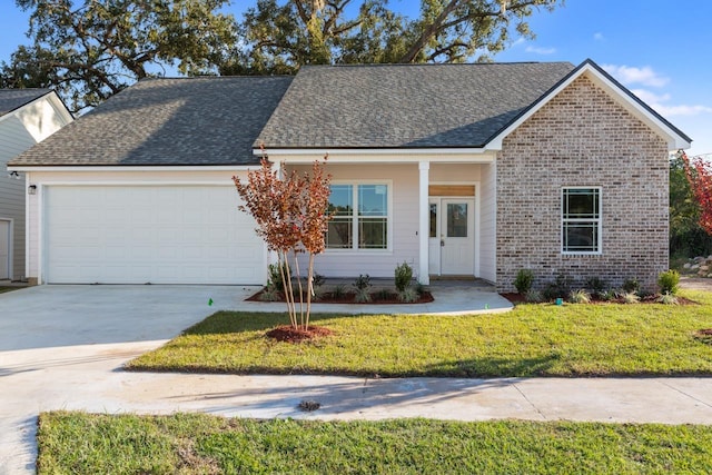 view of front of house with a garage and a front yard