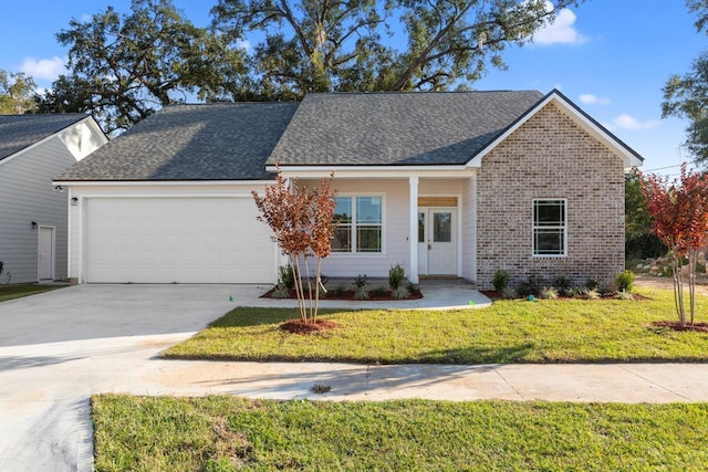 view of front of property with a garage and a front yard