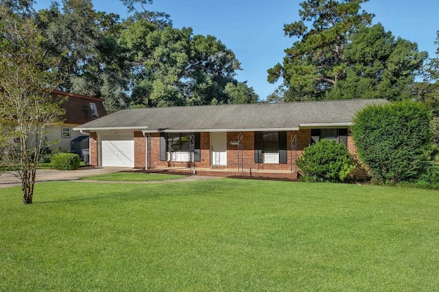 ranch-style house with a garage and a front yard