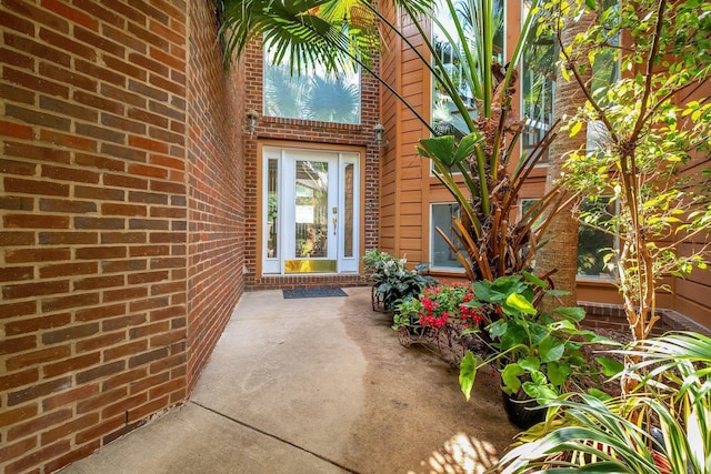 8171 Elysian Way, Tallahassee, FL 32311 - view of exterior entry featuring brick siding and a patio