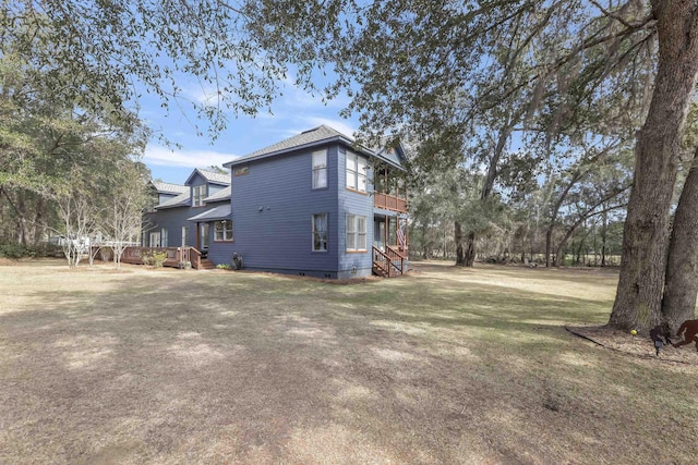 view of property exterior featuring a lawn