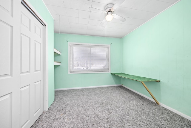 interior space featuring ceiling fan, carpet flooring, and a closet