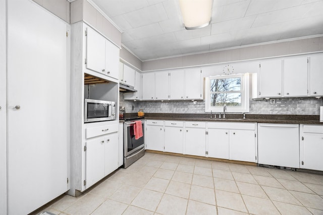 kitchen with white cabinetry, sink, backsplash, and stainless steel appliances