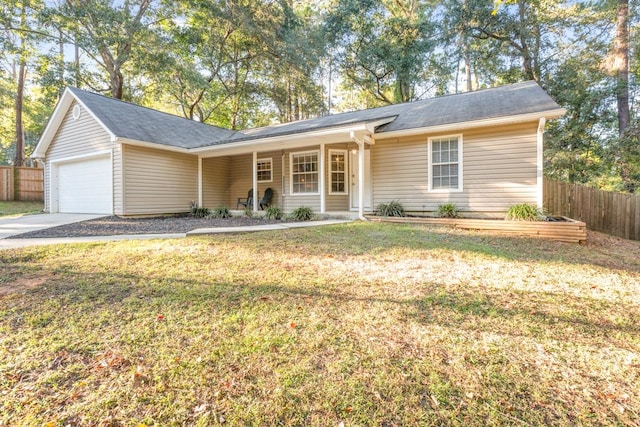 single story home featuring a garage and a front yard