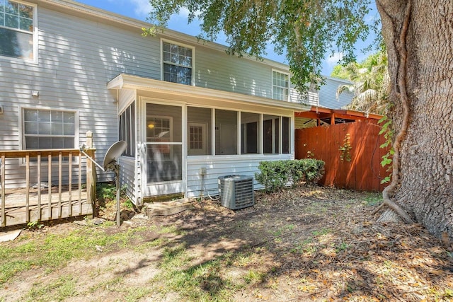 2467 Nugget Ln, Tallahassee, FL 32303 - back of property with a sunroom and central AC unit