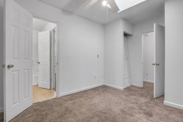 2467 Nugget Ln, Tallahassee, FL 32303 - unfurnished bedroom with carpet floors, ensuite bath, baseboards, and ceiling fan