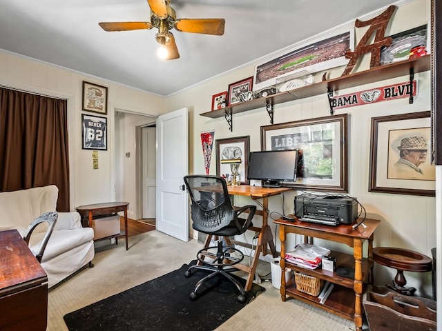 carpeted home office with ceiling fan