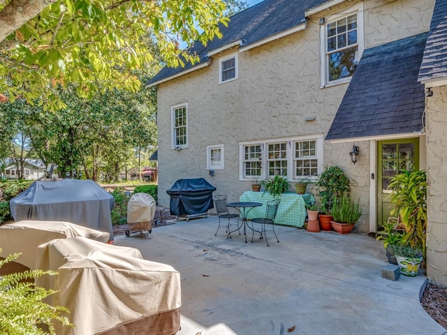 back of property with a patio area