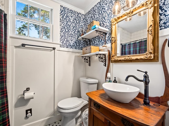 bathroom featuring toilet, a shower with curtain, vanity, and crown molding