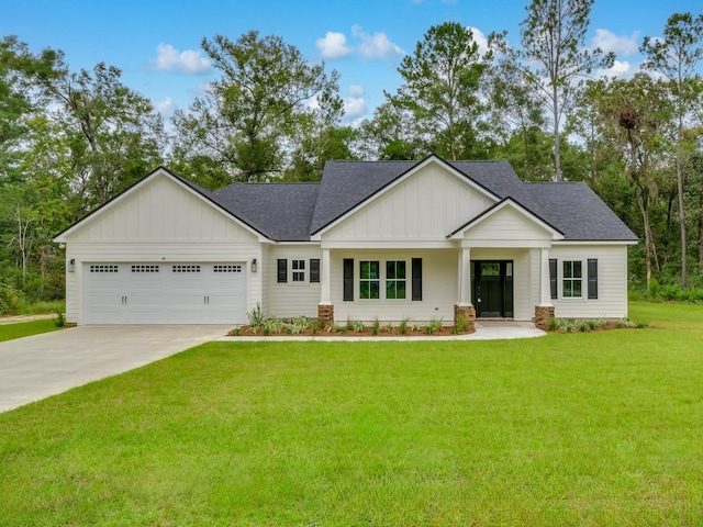 view of front of house with a front lawn and a garage