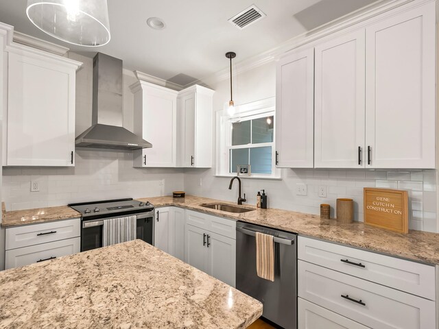 kitchen with white cabinets, wall chimney exhaust hood, and appliances with stainless steel finishes