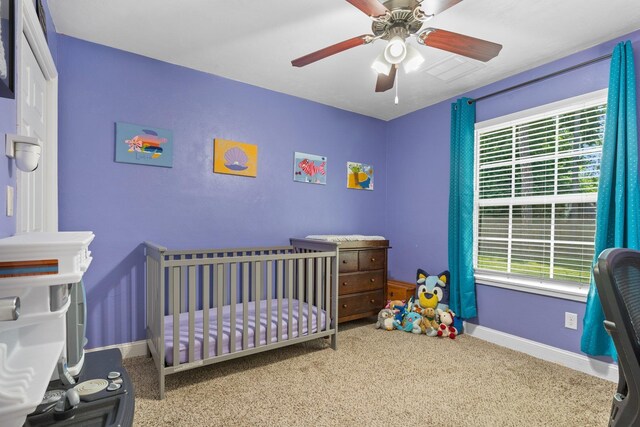 6812 Hill Gail Trl, Tallahassee, FL 32309 - bedroom with multiple windows, baseboards, a nursery area, and carpet flooring
