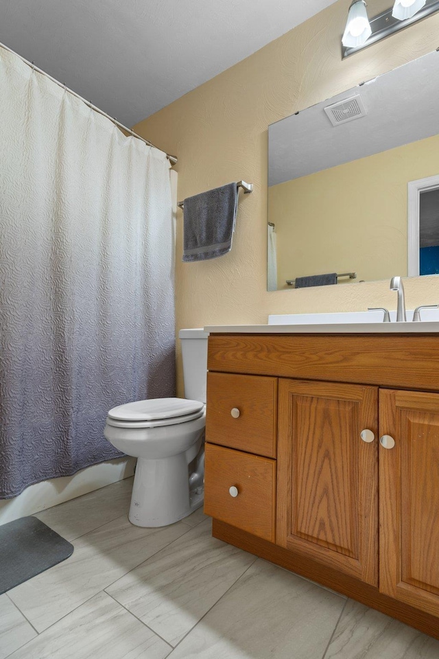 6812 Hill Gail Trl, Tallahassee, FL 32309 - bathroom featuring toilet, vanity, and shower / bathtub combination with curtain