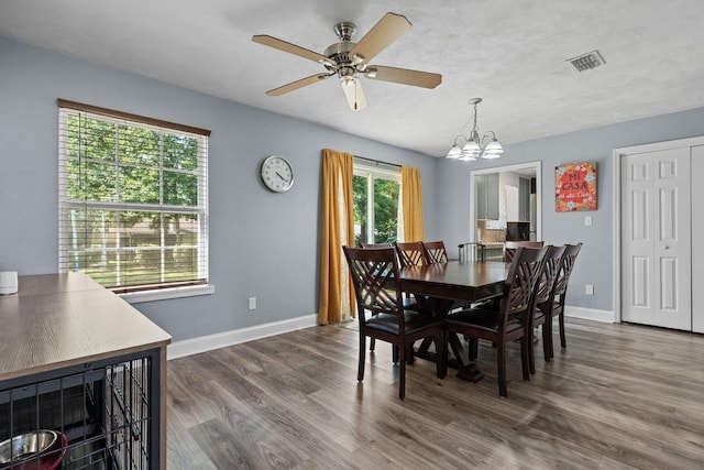 6812 Hill Gail Trl, Tallahassee, FL 32309 - dining space with a chandelier, baseboards, dark wood-style flooring, and a ceiling fan