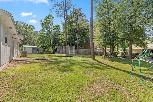 6812 Hill Gail Trl, Tallahassee, FL 32309 - view of yard featuring a trampoline, a shed, a playground, and an outbuilding