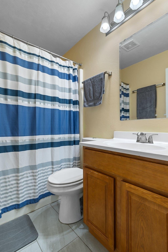 6812 Hill Gail Trl, Tallahassee, FL 32309 - bathroom with toilet, vanity, a shower with curtain, and tile patterned floors