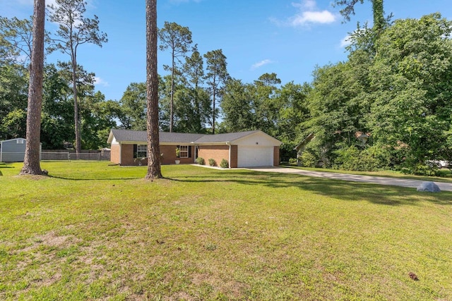 6812 Hill Gail Trl, Tallahassee, FL 32309 - view of front of house featuring an attached garage, concrete driveway, and brick siding