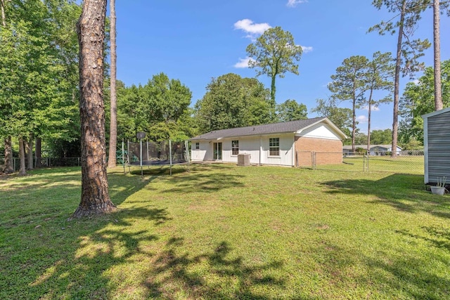 6812 Hill Gail Trl, Tallahassee, FL 32309 - rear view of property with a trampoline