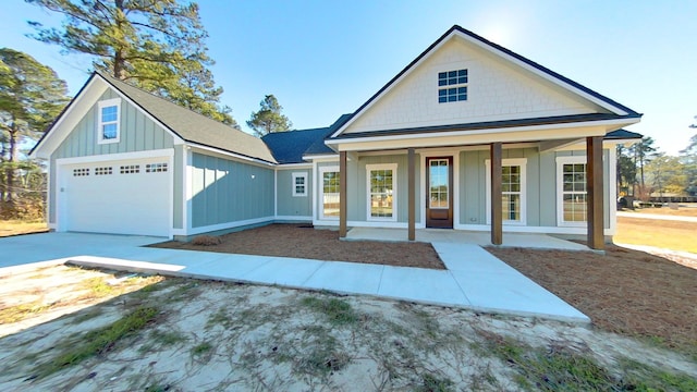 view of front facade with a porch and a garage