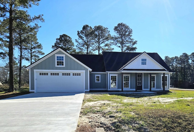 view of front of property featuring a garage and a porch