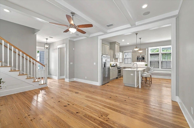 1261 Myrtle View Dr, Tallahassee, FL 32312 - interior space featuring a sink, visible vents, light countertops, stainless steel appliances, and gray cabinetry