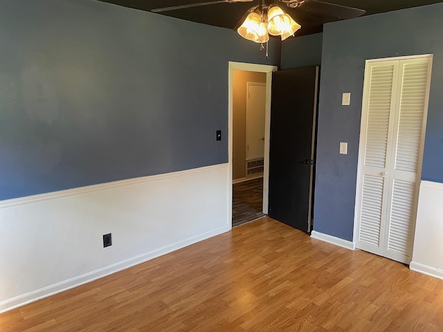 320 Lancaster Dr, Tallahassee, FL 32304 - unfurnished bedroom featuring a closet, a ceiling fan, wood finished floors, and baseboards