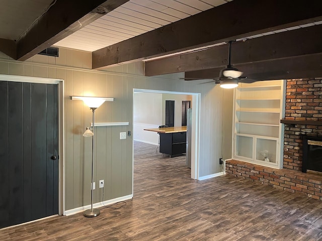 320 Lancaster Dr, Tallahassee, FL 32304 - unfurnished living room with beamed ceiling, a ceiling fan, wood finished floors, and baseboards