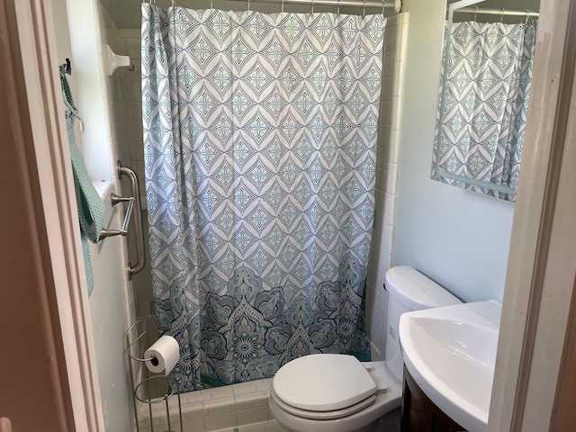 320 Lancaster Dr, Tallahassee, FL 32304 - bathroom with toilet, a shower with curtain, and a sink