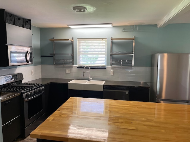 320 Lancaster Dr, Tallahassee, FL 32304 - kitchen featuring tasteful backsplash, stainless steel appliances, open shelves, wooden counters, and a sink