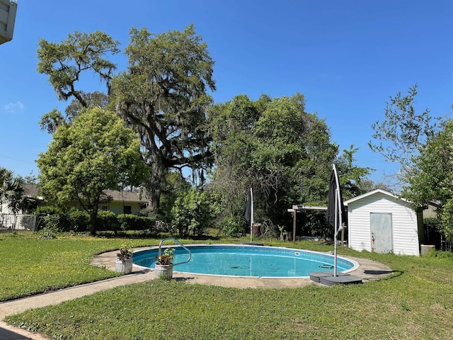 320 Lancaster Dr, Tallahassee, FL 32304 - outdoor pool featuring a storage shed, a yard, and an outdoor structure