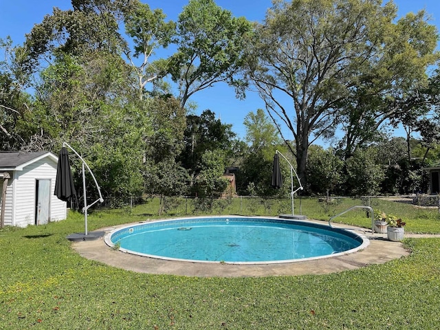 320 Lancaster Dr, Tallahassee, FL 32304 - outdoor pool with an outdoor structure, a yard, and a storage unit