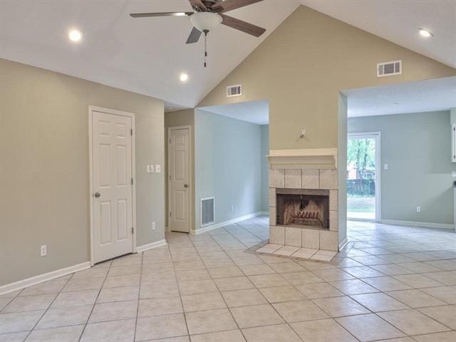 unfurnished living room featuring light tile patterned flooring, a tiled fireplace, visible vents, and a ceiling fan