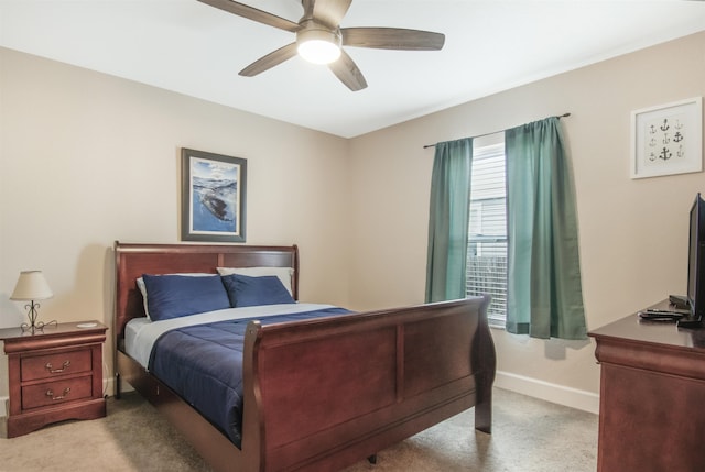 bedroom with light colored carpet and ceiling fan