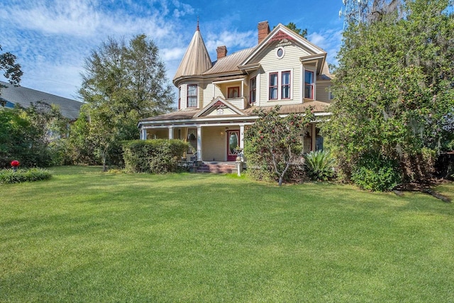 victorian home featuring a front yard and a porch