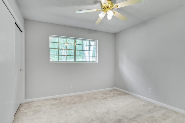 2309 Trimble Rd, Tallahassee, FL 32303 - unfurnished bedroom with baseboards, a textured ceiling, a closet, and carpet flooring