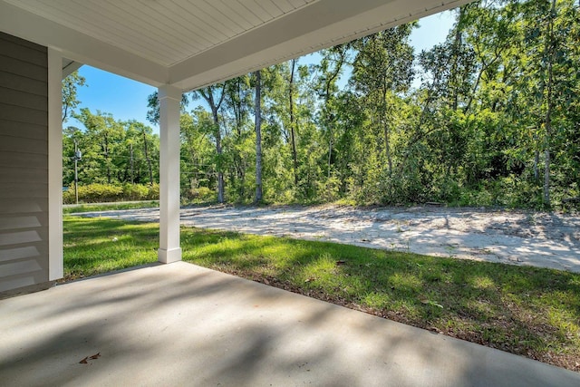 view of patio / terrace featuring a forest view