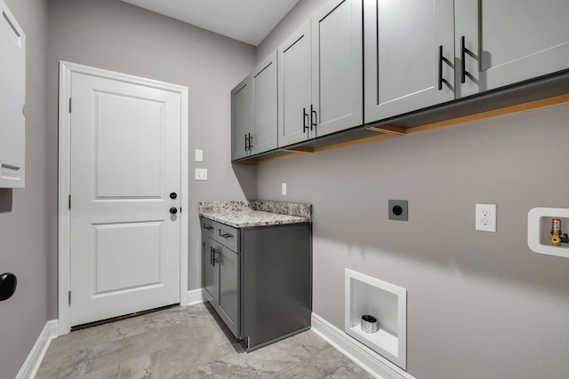 laundry room with electric dryer hookup, baseboards, hookup for a washing machine, cabinet space, and marble finish floor
