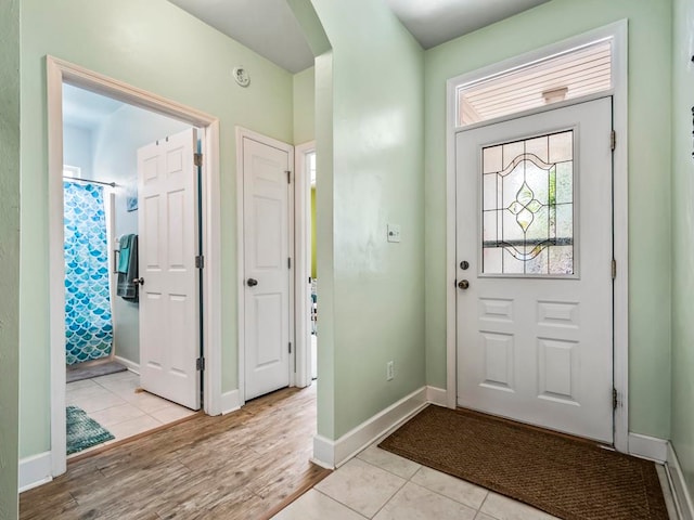 foyer entrance with light hardwood / wood-style floors