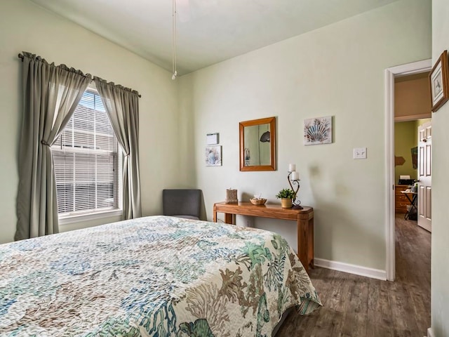 bedroom featuring dark hardwood / wood-style flooring and ceiling fan