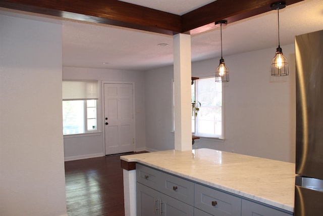 kitchen featuring gray cabinets, pendant lighting, a healthy amount of sunlight, and dark hardwood / wood-style floors