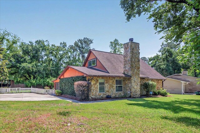 6847 Donerail Trl, Tallahassee, FL 32309 - view of front of property featuring stone siding and a chimney