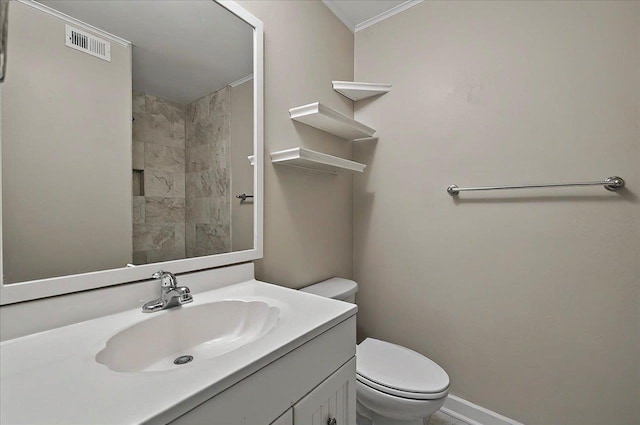 6847 Donerail Trl, Tallahassee, FL 32309 - bathroom featuring toilet, vanity, baseboards, a tile shower, and crown molding