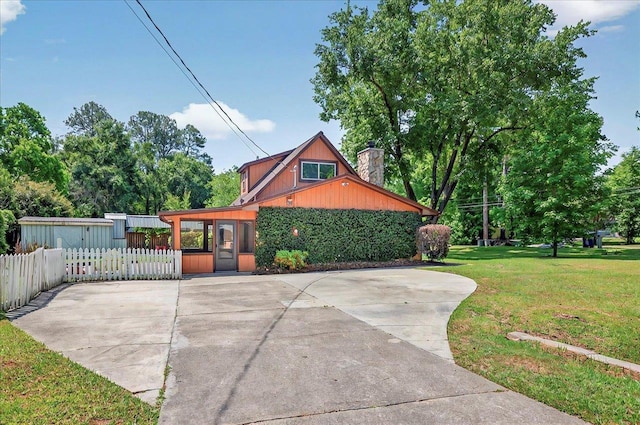 6847 Donerail Trl, Tallahassee, FL 32309 - view of property exterior featuring a chimney
