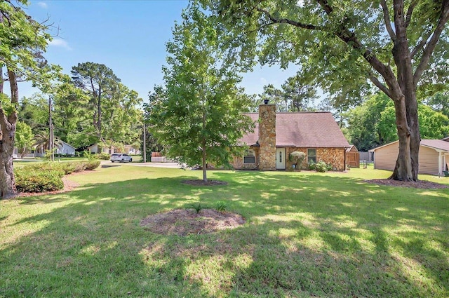 6847 Donerail Trl, Tallahassee, FL 32309 - view of front of property featuring a chimney, a front yard, and stone siding