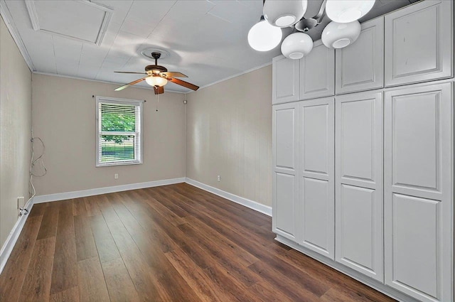 6847 Donerail Trl, Tallahassee, FL 32309 - unfurnished bedroom featuring baseboards, dark wood finished floors, crown molding, and a ceiling fan