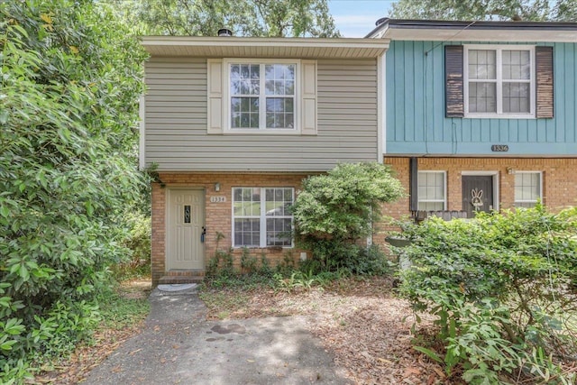 1334 Jackson St, Tallahassee, FL 32303 - view of front facade with brick siding and board and batten siding