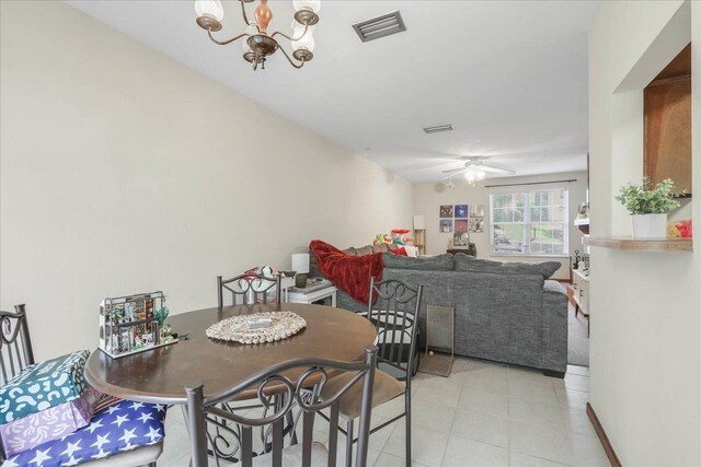 1334 Jackson St, Tallahassee, FL 32303 - dining area with light tile patterned floors, ceiling fan with notable chandelier, and visible vents