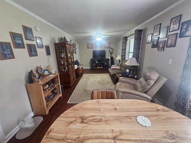 living room featuring dark wood-type flooring, ceiling fan, and crown molding