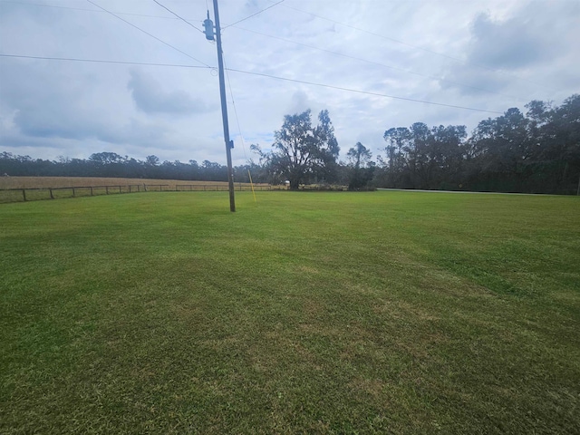 view of yard with a rural view