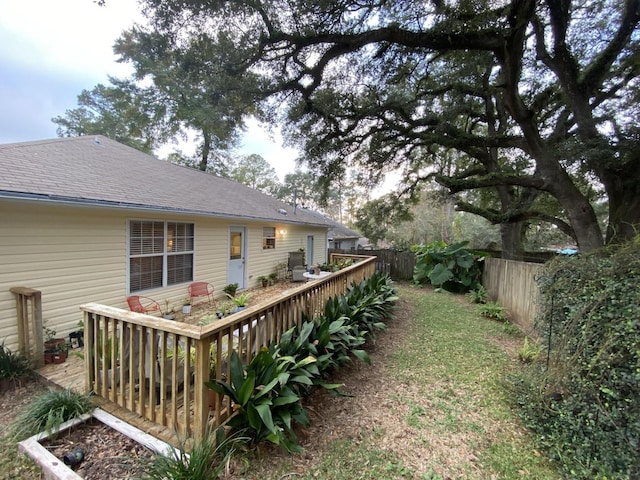 view of yard with a fenced backyard and a deck